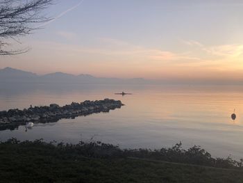 Scenic view of lake against sky during sunset