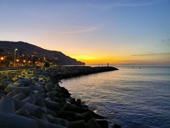 Scenic view of sea against sky during sunset
