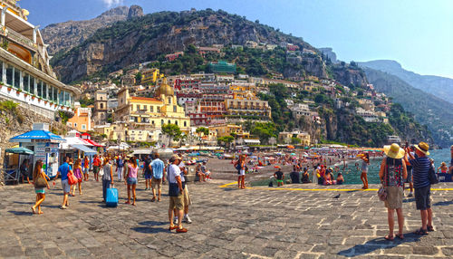 Crowds on walkway and beach at positano