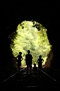 Silhouette people in cave
