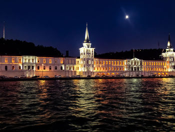 Illuminated buildings in city at night