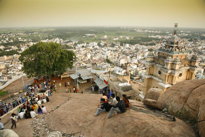 High angle view of crowd and buildings in city