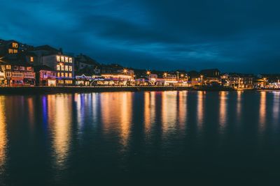 Illuminated city at waterfront