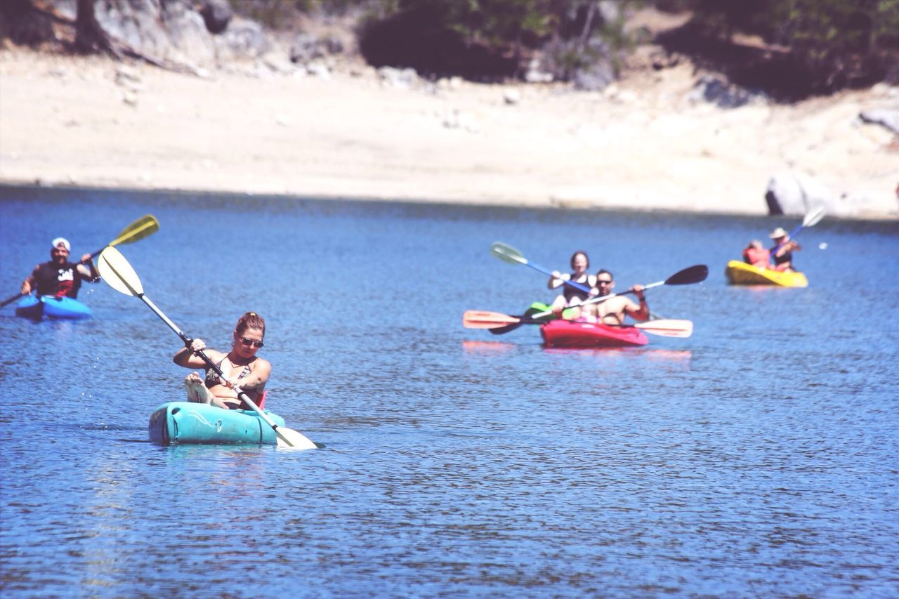 PEOPLE IN BOAT ON WATER