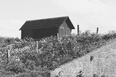 House on field against sky