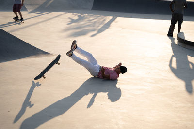 Low section of man skateboarding on skateboard