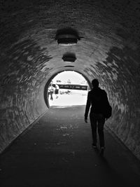 People walking in tunnel