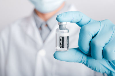 Midsection of person holding smart phone