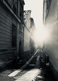 Street amidst buildings in city against sky