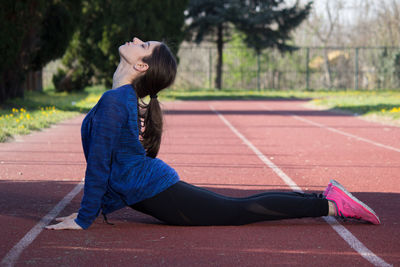 Side view of young woman looking away