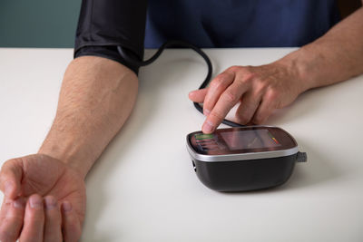 Midsection of man preparing food on table