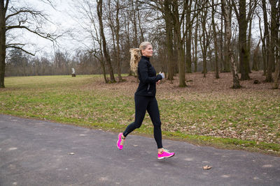 Full length of woman running outdoors