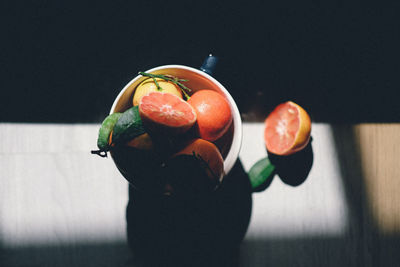 Directly above shot of fruits in container on table