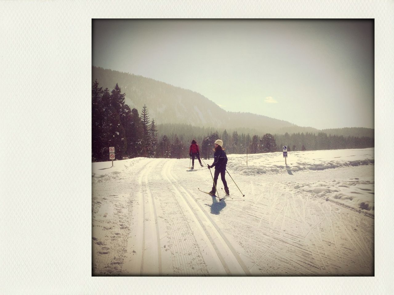 rear view, transfer print, mountain, full length, winter, snow, cold temperature, walking, lifestyles, auto post production filter, men, leisure activity, sky, clear sky, season, mountain range, tranquil scene, standing