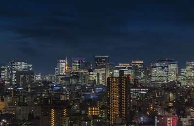 Aerial night panoramic view of the skyscrapers of tokyo illuminated.