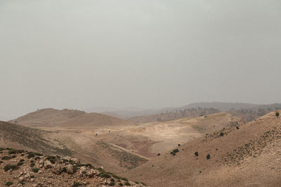 Scenic view of desert against clear sky