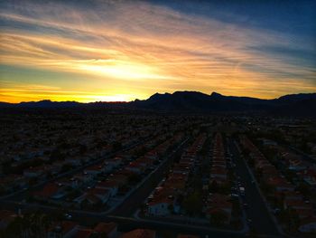 High angle view of city during sunset
