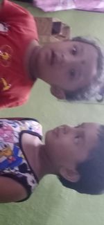 Portrait of boy lying on couch