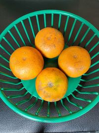 High angle view of fruits in basket on table