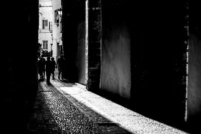 Rear view of people walking on street