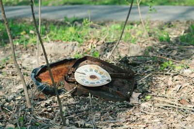 High angle view of abandoned clock on field