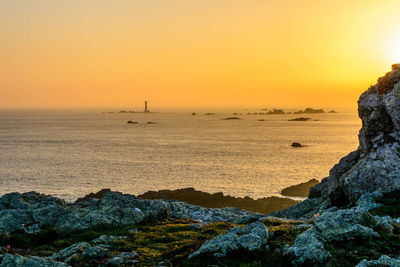 Scenic view of sea against sky during sunset