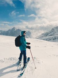 Man skiing on snow covered mountain