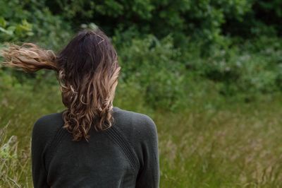 Rear view of woman on grass