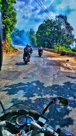 Man riding bicycle on road