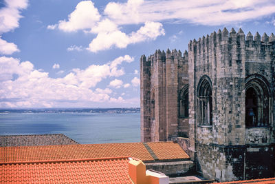 Panoramic view of sea and buildings against sky