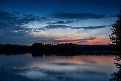 Reflection of trees in calm lake