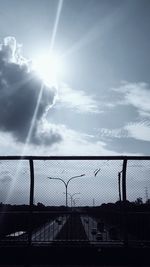 Silhouette fence against sky