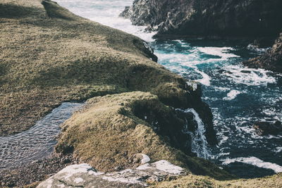 High angle view of rocks in sea
