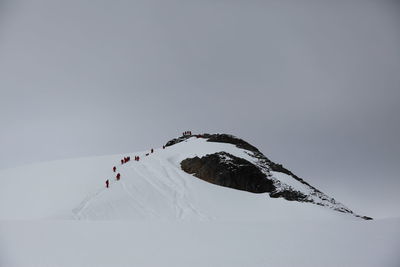 Scenic view of snowcapped mountain against sky