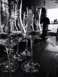 Close-up of wine glasses on table