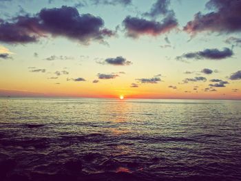 Scenic view of sea at sunset