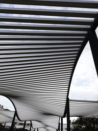 Low angle view of metallic structure against sky