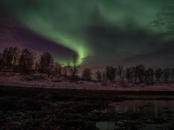 Scenic view of landscape against sky at night