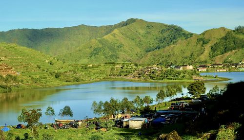 Scenic view of lake and mountains against sky