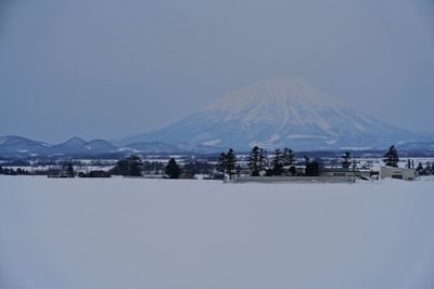 Scenic view of snowcapped mountains against clear sky