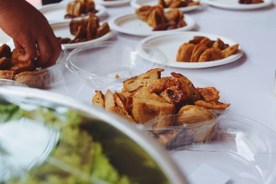 High angle view of sweet food served in plates on table