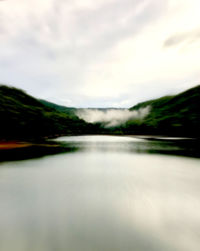 Surface level of water on land against sky