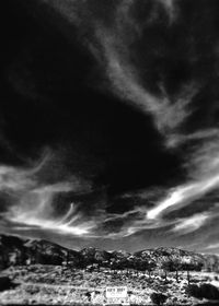 Cityscape against cloudy sky