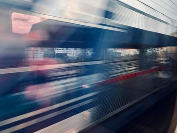 Blurred motion of train at railroad station platform