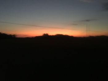 Scenic view of silhouette landscape against sky during sunset