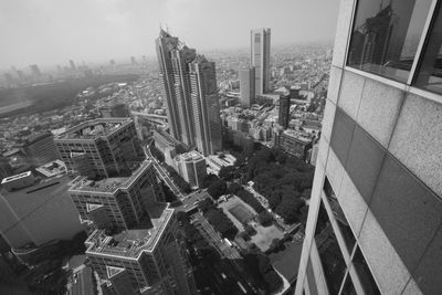 High angle view of buildings in city against sky