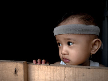 Portrait of cute boy looking away