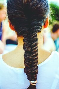 Rear view of woman with braided hair