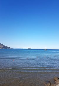 View of sea against blue sky