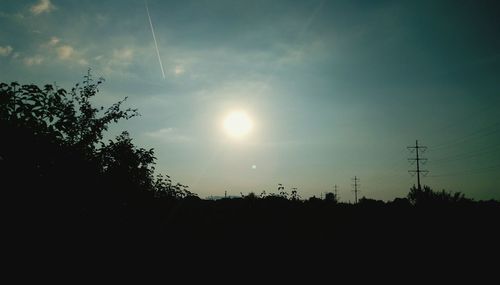 Low angle view of silhouette trees against sky during sunset